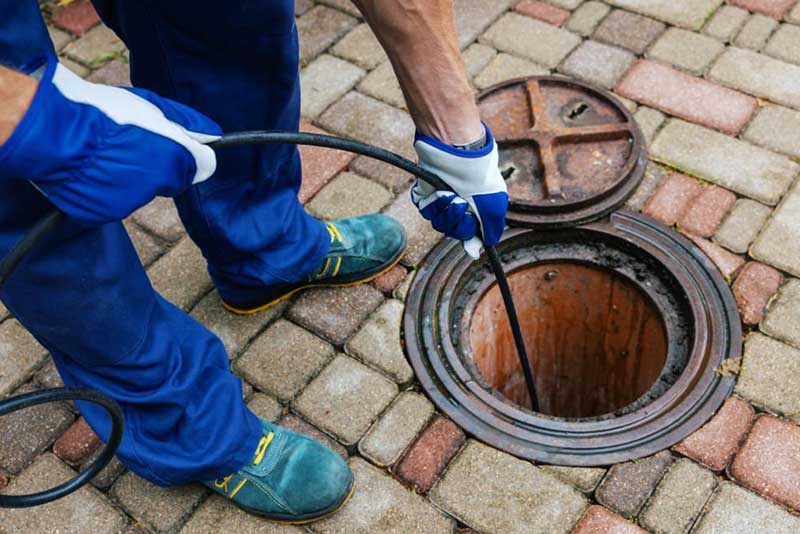 technician performs plumbing services.